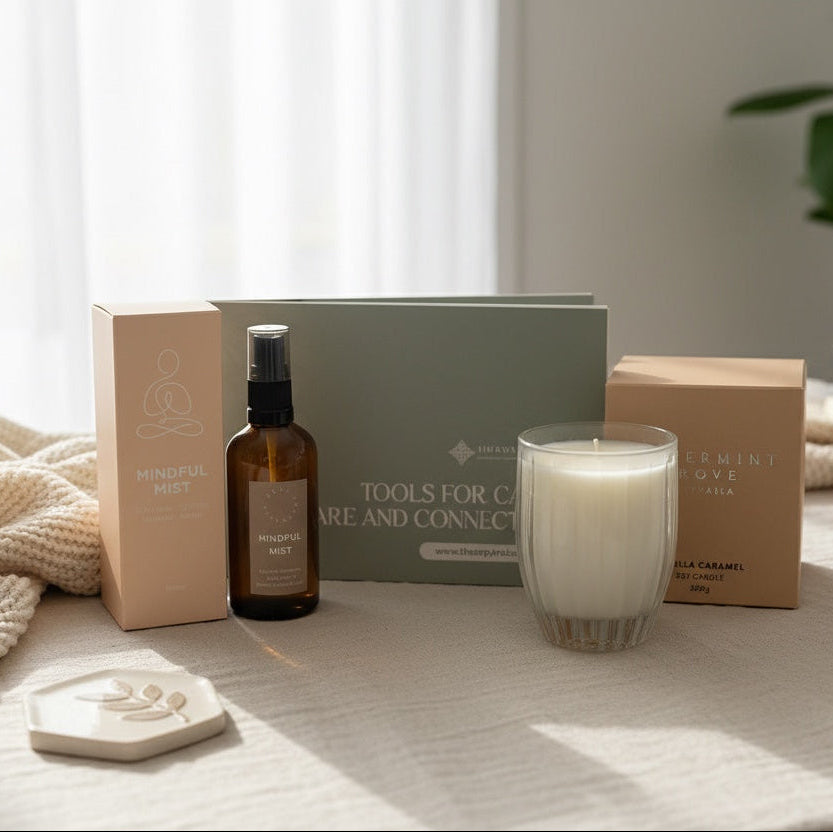A wellness gift set arranged on a light fabric surface in soft natural light. 