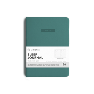 A teal hardcover sleep journal by MiGoals, featuring a white paper band around the middle with product details, shown on a clean white background.