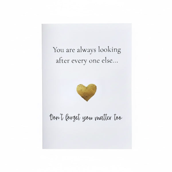 A white greeting card with black text reading 'You are always looking after every one else.