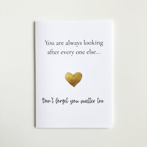 A white greeting card with black text reading 'You are always looking after every one else.
