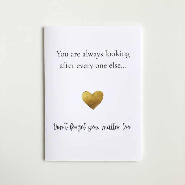 A white greeting card with black text reading 'You are always looking after every one else.
