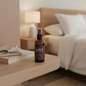 Salt.T Magnesium Sleep & Anxiety Blend 100ml spray bottle styled on a shelf with warm ambient lighting