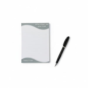 Notepad with pen on a white background