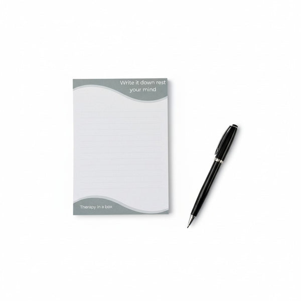 Notepad with pen on a white background
