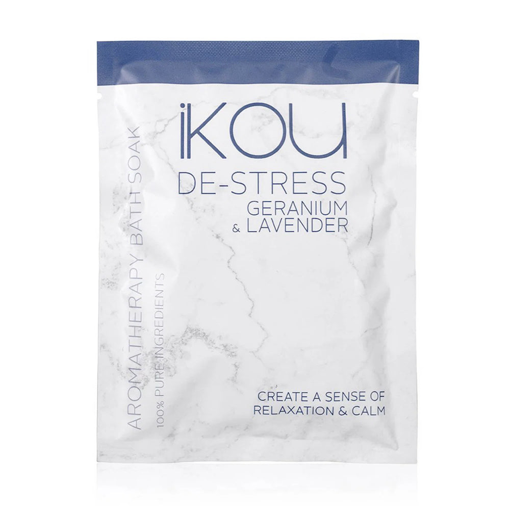 A package of iKOU De-Stress Bath Soak in Geranium & Lavender scent, featuring a white marble-patterned pouch with a blue top band and blue text.