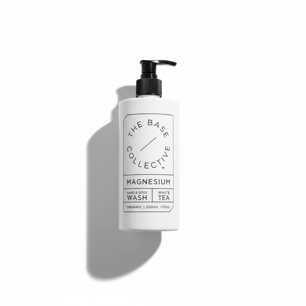 white bottle reading the base collective sitting on a white background