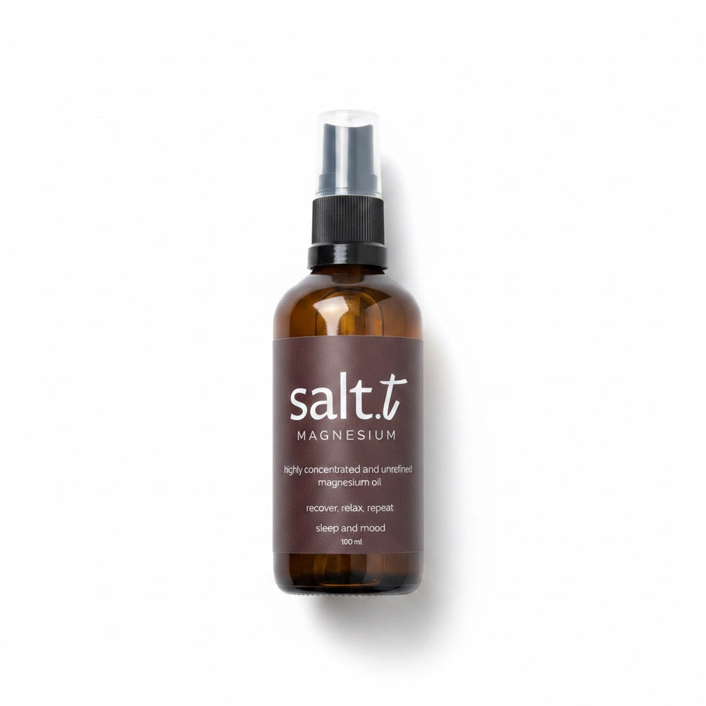 A brown glass spray bottle of Salt.T Magnesium Sleep & Anxiety Blend with a black pump and clear cap, set against a plain white background with a soft shadow